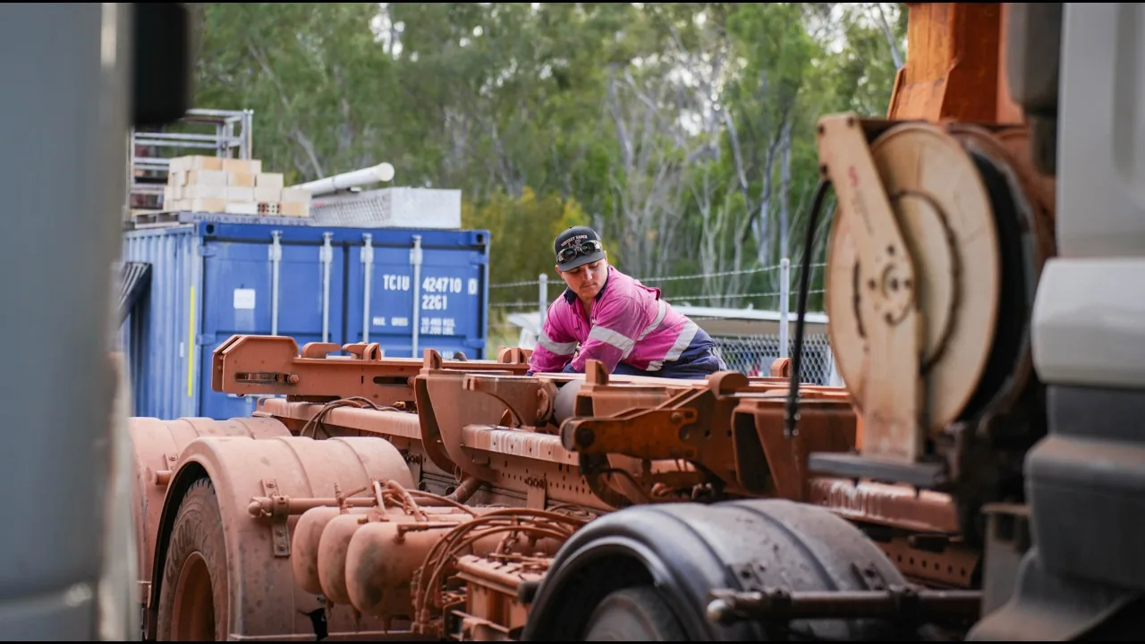 ACES technician working on a heavy vehicle in the Callemondah yard, Gladstone